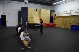 kids listening to instructor at parkour class