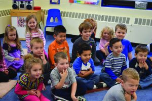 kids sitting at storytime at preschool