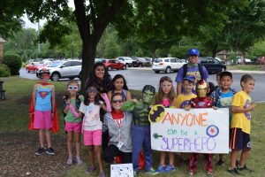 kids dressed as superheroes