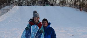 kids on sled hill