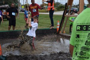 kids running in obstacle course race having fun