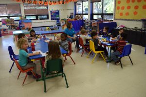 kids in preschool at tables