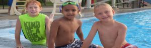 kids happy by the swimming pool