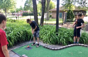 kids playing mini-golf