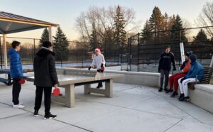 kids playing on burning bush park ping pong table