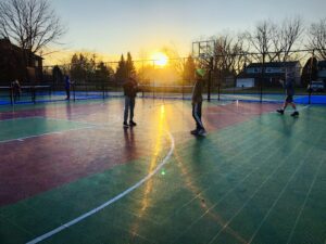 kids playing on burning bush park basketball court